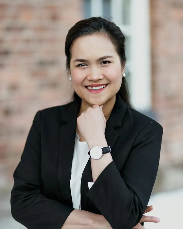 Dr Mei-Lin Chen photographed in natural light against a plain background
