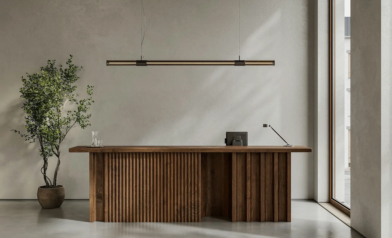 A detail of the reception desk with planting and warm wood